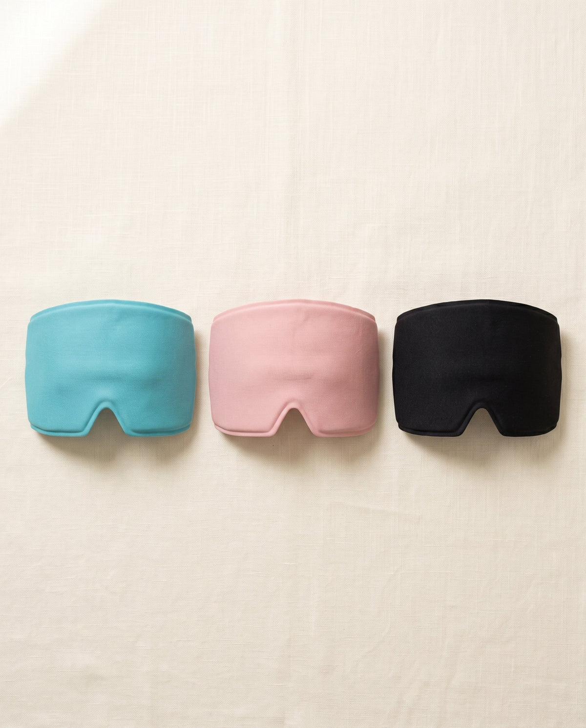 Gorro de gel AliviaCap en tres colores: azul turquesa, rosa y negro